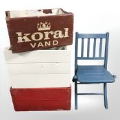 Three painted pine bottle crates and small child's folding chair.