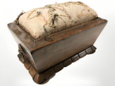 A Victorian rosewood sarcophagus form pin cushion with twin lion mask handles, width 15 cm.
