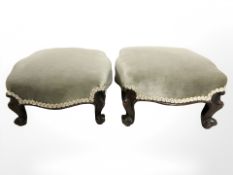 A pair of Victorian mahogany low footstools in pale green draylon, width 32 cm.