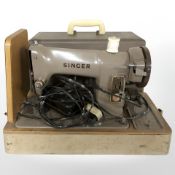 A vintage electric sewing machine and a Fidelity portable record player