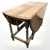 An oak barley twist gateleg table, width 106 cm.