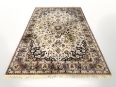 A machine made rug of Isfahan design,