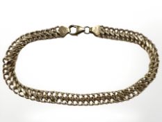 A 9ct yellow gold flat link bracelet, length 21 cm. CONDITION REPORT: 4.