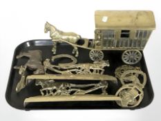A group of brass wares including horse and cart, two doorstops, horse brasses, etc.