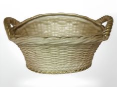 A Royal Worcester blush ivory porcelain basket, shape No. 2365, width 19 cm.