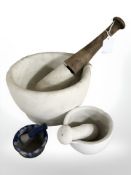 Three mortars and pestles, largest mortar 21 cm diameter.