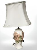 A Moorcroft table lamp with shade, height 57 cm.