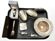 A group of silver-mounted dressing table brushes, a silver cigarette case,
