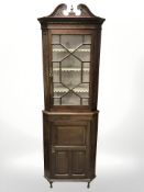 A 19th century glazed oak corner cabinet, height 217 cm.