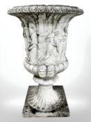 A weathered concrete campana urn on square stepped plinth, urn 94 cm high,