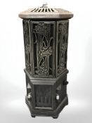 An cast iron electric heater in the form of a stove,