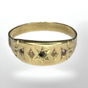 An antique 18ct yellow gold ring set with three rubies, size O. CONDITION REPORT: 2g.