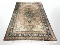 A silk-piled rug of Isfahan design, 255 cm x 154 cm.