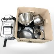 A Tefal fryer, a group of stainless steel cooking pans and utensils.