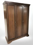 A reproduction triple door wardrobe,