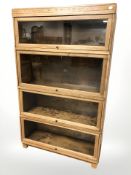 An Edwardian Globe-Wernicke glazed oak four height stacking bookcase,