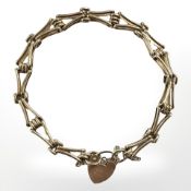 A 9ct yellow gold fancy link bracelet with padlock clasp CONDITION REPORT: 10.9g.