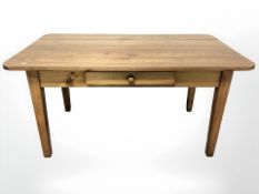 A Victorian pine farmhouse table fitted with a drawer,