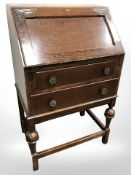 A 20th century oak bureau, width 60 cm.