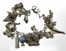 A silver charm bracelet CONDITION REPORT: 100.6g.