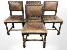 A set of four Edwardian oak and studded leather dining chair.