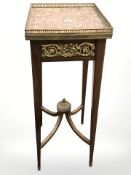 A 20th century mahogany and gilt metal mounted plant stand, with brass galleried marble inset top,