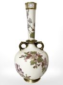 A Royal Worcester blush ivory twin handled vase with pierced tapering neck, height 33.5 cm.