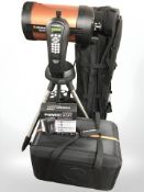 A Celestron Mex Star telescope with power tank lithium power pack and carry bag