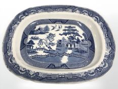 A large Middlesborough Pottery blue and white transfer printed willow pattern meat draining plate,