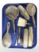 A group of silver mounted dressing table brushes, mirror, button hooks, etc.