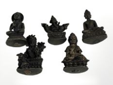 A group of oriental bronze miniature figures of deities, Buddha, etc, each approximately 3.