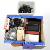 A quantity of electronic notebooks, assorted power cables, etc.