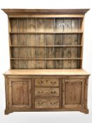 A Victorian pine farmhouse kitchen dresser, 165 cm W x 55 cm D x 206 cm H.