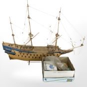 A large scale model of a battleship, length 100 cm, and box containing various crafting parts.