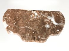 A rouge marble table top, width 85 cm.