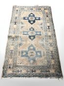 An Anatolian rug, 230 cm x 136 cm.