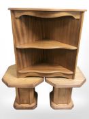 A reproduction corner shelf and a pair of octagonal tables.