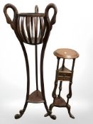 A reproduction mahogany jardiniere stand, with swan neck supports, height 130 cm,