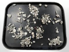 A large quantity of silver charms and charm bracelets, 778g.