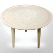 A contemporary tripod occasional table,