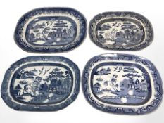 A group of graduated blue and white transfer printed willow pattern meat plates, largest 47 cm wide.