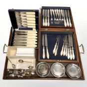 An oak twin handled serving tray, two cased sets of fish cutlery, EPNS coasters, teaspoons, etc.