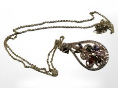 A multi gem set costume pendant on chain.