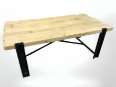 A rustic pine and metal rectangular coffee table, 120 cm x 60 cm x 45 cm.