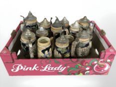 A collection of German musical pottery steins.