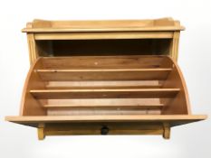 A fall front shoe cabinet,