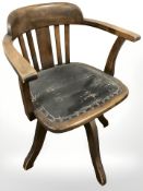An Edwardian beech desk chair.