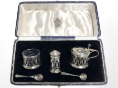 A silver cruet set in Reid & Sons box.