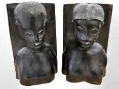 A pair of African carved ebony bookends,