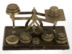 A set of Victorian brass letter scales with various weights.